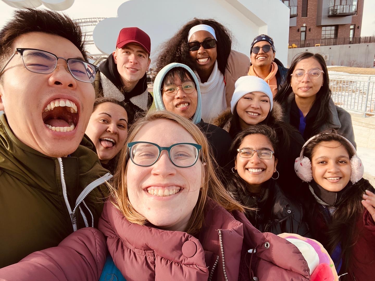 Selfie-style picture of new 2023 international students with global panther success team members