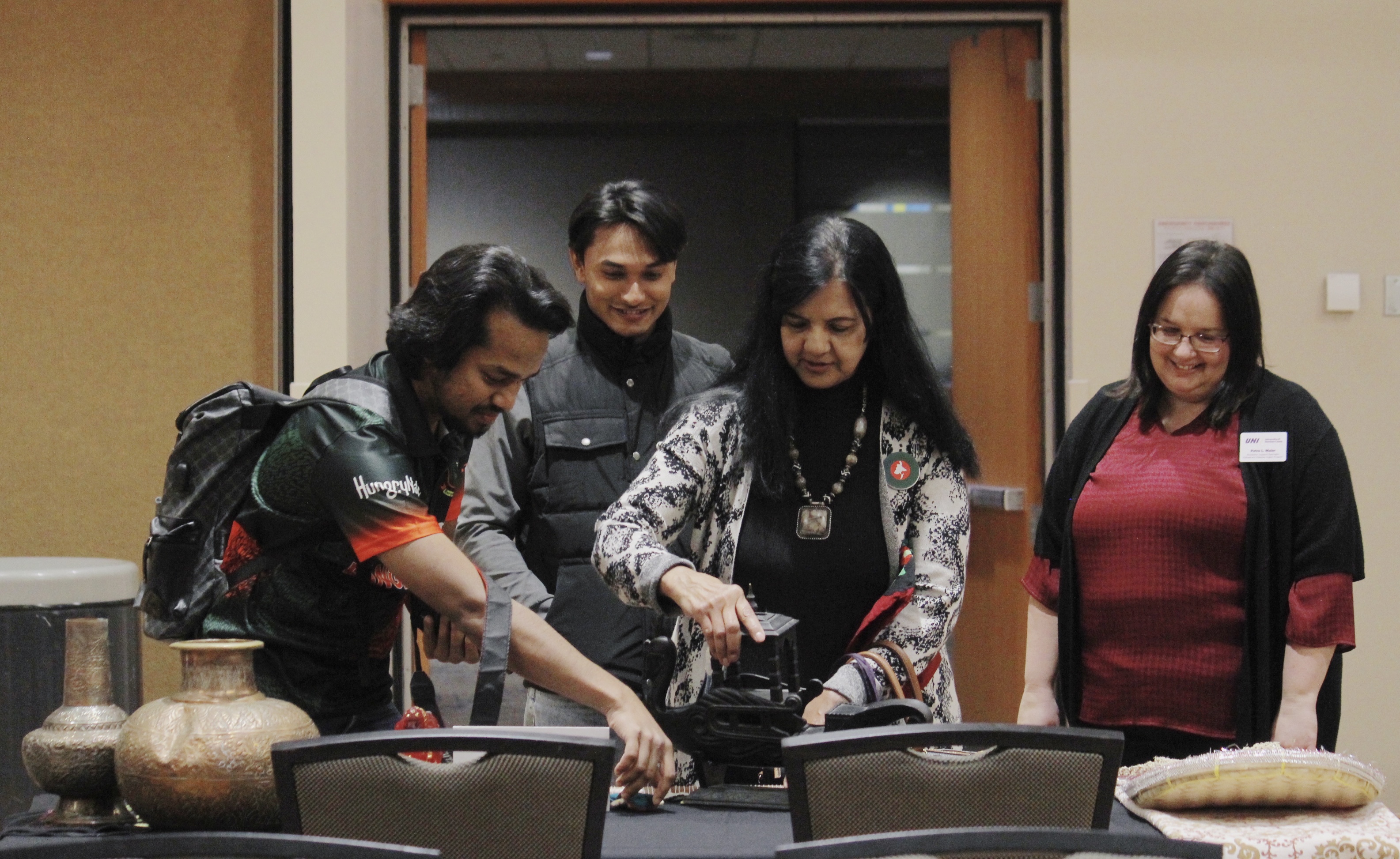 students setting up cultural table 