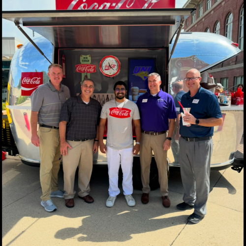 Gavik with UNI Staff at Coca-Cola booth