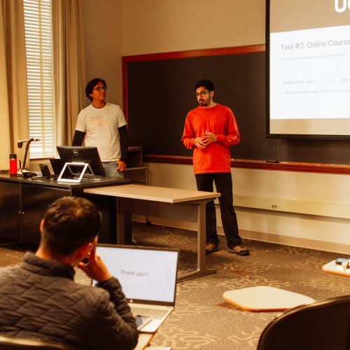 photo, grad Pathways students giving a presentation