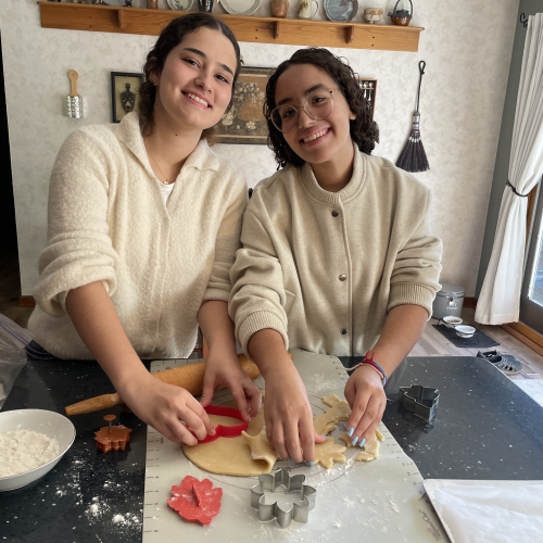 Two Brazilian students cooking at Moria's residence